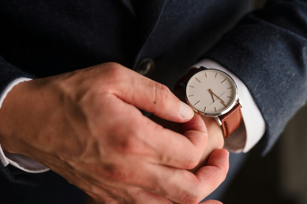 Hands holding an automatic watch before putting it on